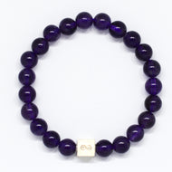 Amethyst bracelet with round purple beads and silver infinity charm on a white background by MysticFlavia