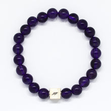 Load image into Gallery viewer, Close-up amethyst bracelet with MysticFlavia silver bead and polished natural stone beads
