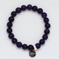 Amethyst bracelet with round 8MM beads and silver charm on white background by MysticFlavia