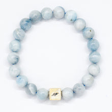 Load image into Gallery viewer, MysticFlavia Aquamarine Birthstone bracelet with soft blue beads, carved 925 sterling silver beads and square brand tag, white background

