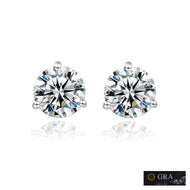 Round moissanite earrings by MysticFlavia shown with brilliant-cut stones on a white background