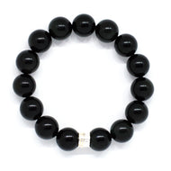 MysticFlavia black obsidian bracelet 12mm flat view with double flat silver bead at bottom on white background
