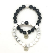 Load image into Gallery viewer, Black Obsidian and White Howlite couple bracelet set with round beads and silver MF charms, MysticFlavia
