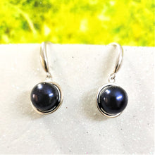 Load image into Gallery viewer, Black natural pearl drop earrings in silver settings displayed on a white surface
