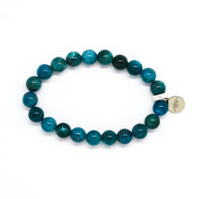 Load image into Gallery viewer, Blue Apatite Stone Flat Silver Bead Bracelet 8mm by MysticFlavia showing natural blue apatite gemstone beads, flat 925 sterling silver bead, and signature logo charm.
