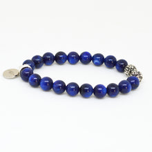 Load image into Gallery viewer, Side profile of Blue Kyanite Stone Silver Bead Bracelet 8mm highlighting polished blue kyanite beads, silver spacer beads and dangling silver charm.
