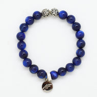 Blue Kyanite Stone Silver Bead Bracelet 8mm with natural round blue kyanite beads, decorative silver spacer beads and silver charm on a white background.
