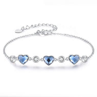Blue Swarovski crystal heart bracelet in silver setting with round sparkling accents