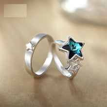 Load image into Gallery viewer, Blue star crystal silver ring displayed on a warm surface
