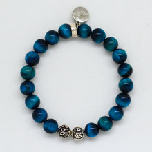Load image into Gallery viewer, MysticFlavia blue tiger eye bracelet showing silver charm pendant detail, white background
