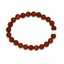 Load image into Gallery viewer, Natural Carnelian gemstone bracelet with twin silver beads on side, clean white background flat lay
