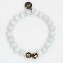 Load image into Gallery viewer, Top view of Cat Eye Pine Stone Silver Bead Bracelet 8MM with polished white gemstone beads and silver charm
