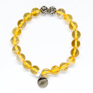 Citrine bracelet with golden crystal beads, decorative silver beads and MysticFlavia charm on white background