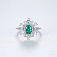 Emerald gemstone silver ring with floral halo design and diamond accents, MysticFlavia