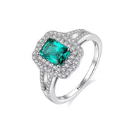 Emerald cut blue gemstone 925 sterling silver halo ring on white background