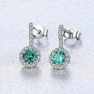 Green oval gemstone drop earrings in 925 sterling silver with a sparkling halo