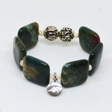 Load image into Gallery viewer, Angled view of MysticFlavia Fancy Jasper Square Bead Bracelet 12MM with silver charm and decorative beads
