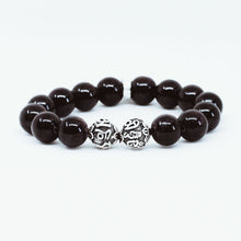 Load image into Gallery viewer, Side view of Garnet Birthstone Silver Bead Bracelet 12mm showcasing polished natural garnet gemstone beads with 925 sterling silver designer beads by MysticFlavia.
