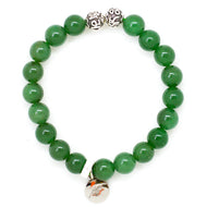 MysticFlavia Green Aventurine bracelet with two ornate 925 sterling silver beads and a round silver charm, laid flat.