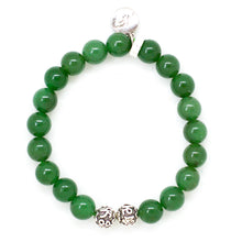 Load image into Gallery viewer, Green Aventurine bracelet by MysticFlavia with two decorative silver beads and a small coin charm, top-down view.
