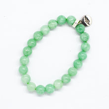 Load image into Gallery viewer, Jade bracelet side view showing beads lined up with round silver pendant
