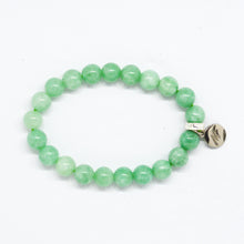 Load image into Gallery viewer, Jade bracelet flat lay showing rounded green beads and small silver charm
