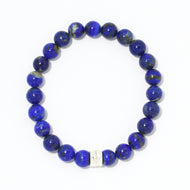 MysticFlavia lapis lazuli bracelet 8mm flat view with single silver double flat bead at bottom on white background
