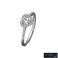Silver moissanite ring with round center stone and halo setting on white background
