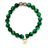 MysticFlavia malachite bracelet 8mm flat view with two engraved silver accent beads at top and round brand charm pendant at bottom
