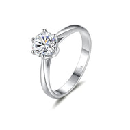 Moissanite silver solitaire ring with round cut center stone on white background