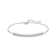Silver chain bracelet with a row of sparkling moissanite stones, adjustable clasp, on white background.