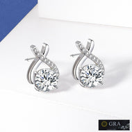 MysticFlavia crossover moissanite earrings with round stones and sparkling pavé detailing