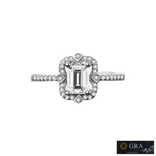 Load image into Gallery viewer, Moissanite ring with emerald cut center stone and halo setting | MysticFlavia
