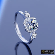 Load image into Gallery viewer, Moissanite ring with round center stone and halo setting in 925 sterling silver by MysticFlavia

