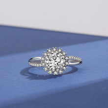 Load image into Gallery viewer, Moissanite silver ring featuring a round center stone and sparkling halo with detailed side stones
