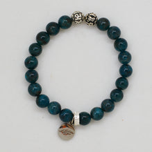 Load image into Gallery viewer, Natural Blue Apatite Crystal Bracelet 8mm Flat Lay with 925 Sterling Silver Charm
