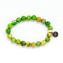 Load image into Gallery viewer, Side view of Natural Olive Green Jasper Flat Silver Bead Bracelet 8MM with flat stone beads by MysticFlavia
