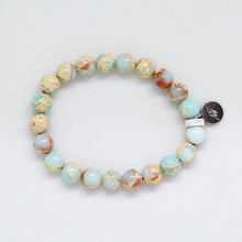 Load image into Gallery viewer, Angled view of Natural Snake Jasper Stone Flat Silver Bead Bracelet 8MM featuring polished Snake Jasper gemstone beads

