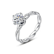 Round cut moissanite silver ring with hexagon accent stones close-up