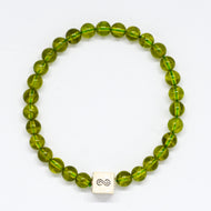 Peridot Stone Infinity Silver Bead Bracelet 8mm with 925 Sterling Silver infinity bead on a white background | MysticFlavia