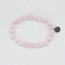 Load image into Gallery viewer, Flat bead bracelet in natural rose quartz with 925 sterling silver charm on white background
