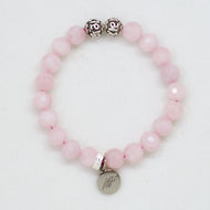 Rose quartz bracelet with faceted pink beads and MysticFlavia silver charm on white background