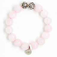 Rose quartz 12MM bead bracelet with silver charm displayed on a white background