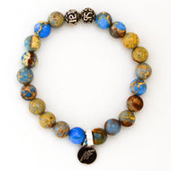 Sea Blue Jasper Stone Silver Bead Bracelet 8MM with sterling silver beads and signature charm on white background