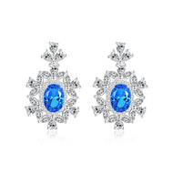 Blue gemstone earrings in 925 sterling silver with intricate floral detailing - MysticFlavia