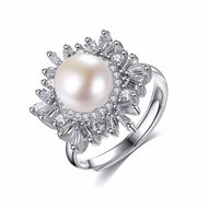 Snowflake pearl ring in silver, paved zircon stones surrounding a natural pearl, front view.