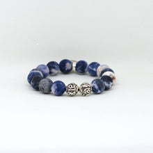 Load image into Gallery viewer, Side profile of Sodalite Matte Stone Silver Bead Bracelet 12MM showcasing natural matte sodalite beads and sterling silver accents
