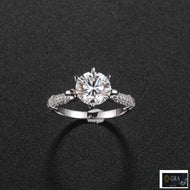 Moissanite solitaire ring with round center stone and sparkling silver band