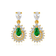 Green gemstone silver earrings with gold accents and crystal detailing