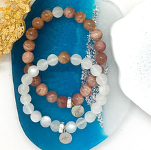 Load image into Gallery viewer, Sunstone and Moonstone Couple Bracelet 8MM displayed on decorative blue and white surface with matching bracelets
